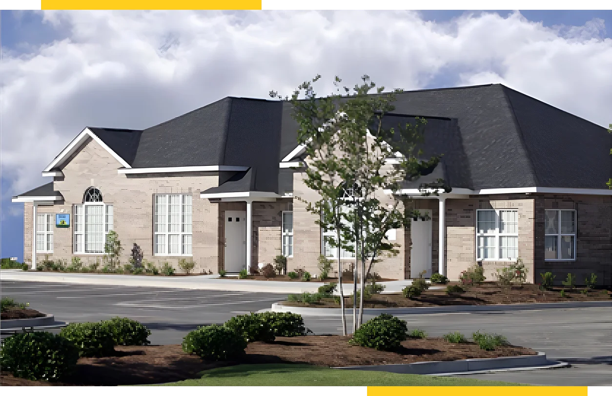 Modern brick building under cloudy sky