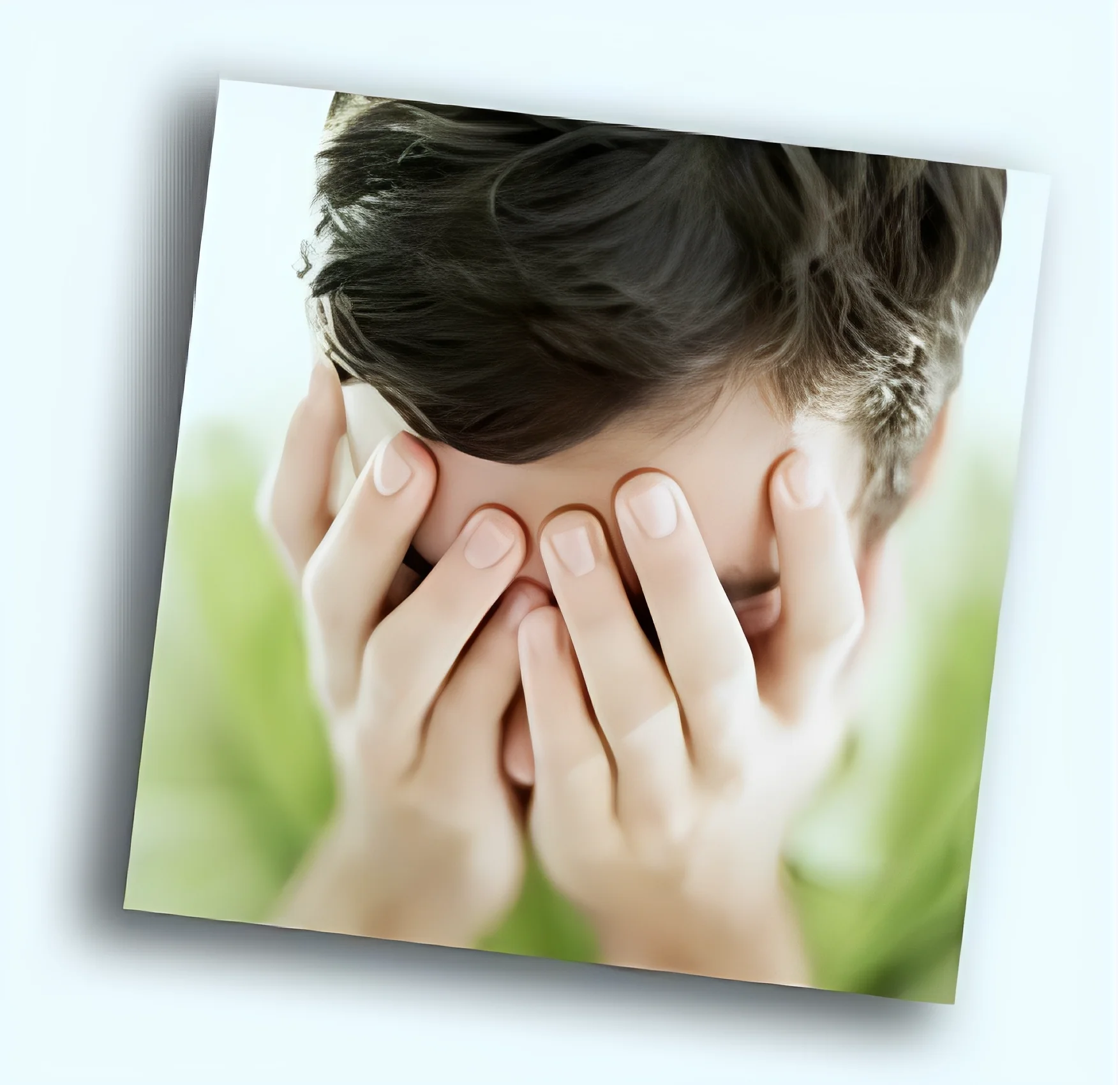 Person covering face with hands